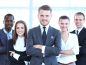 a group of business people posing for a picture.
